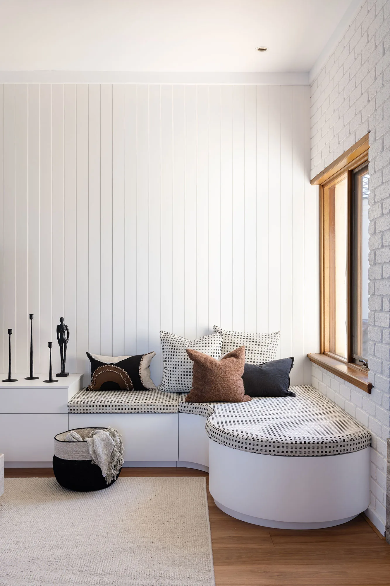 Room by Room Design — custom window seat with patterned cushions and vertical-board cladding