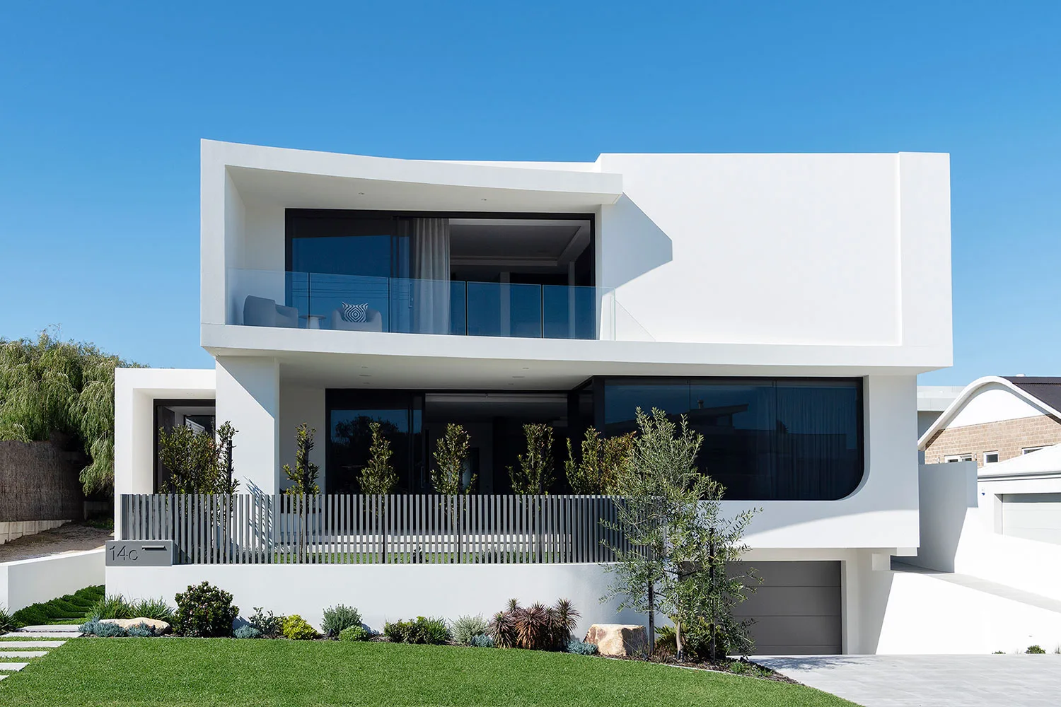 Marmion home — modern white facade with curved balcony