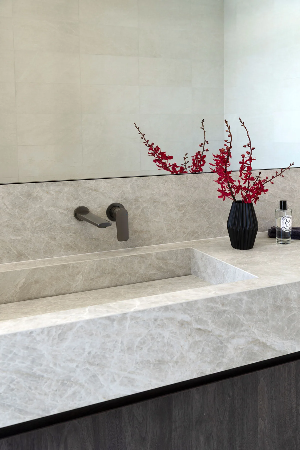 Marmion home — stone vanity with red orchids