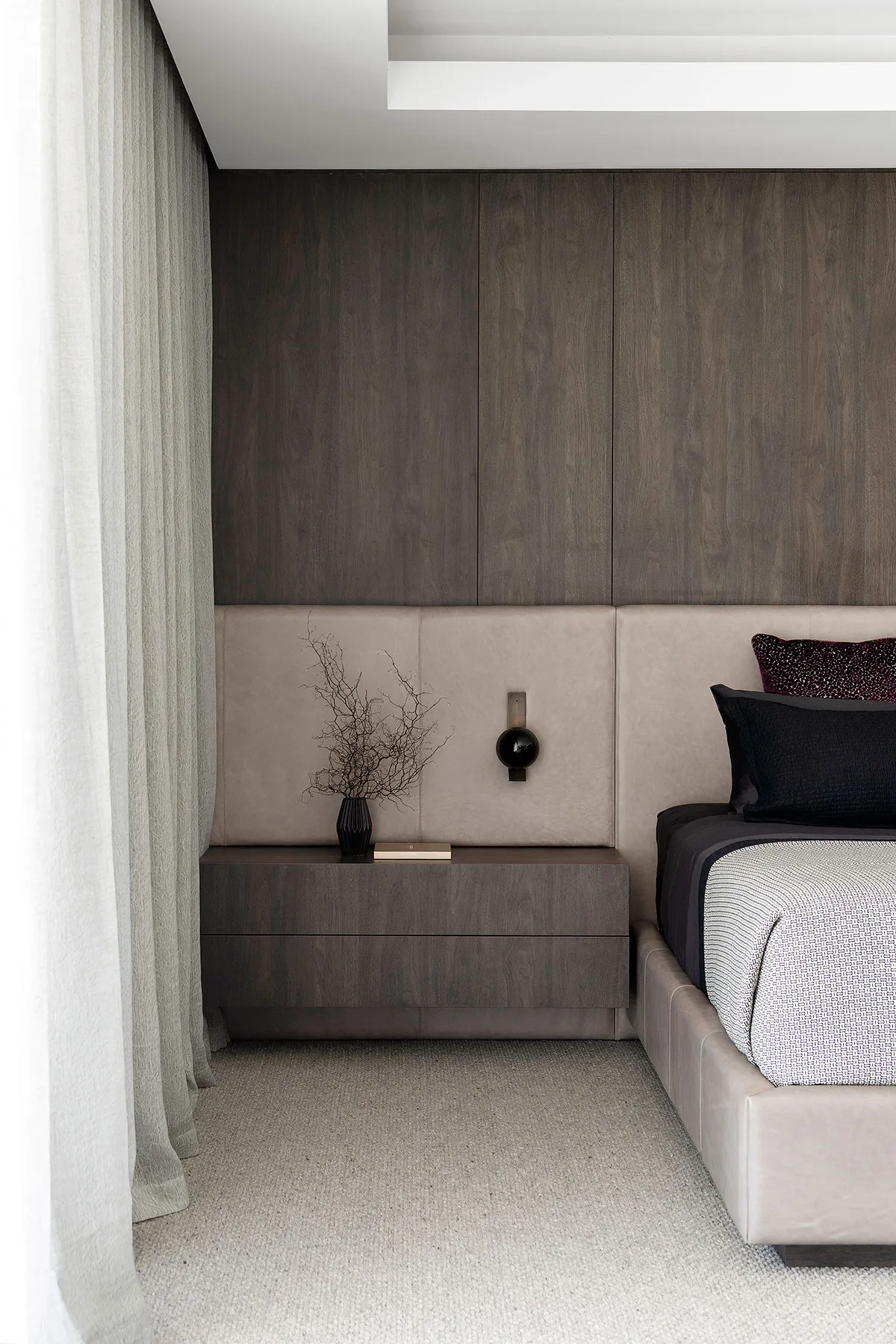 Marmion home — bedroom with timber feature wall and upholstered headboard